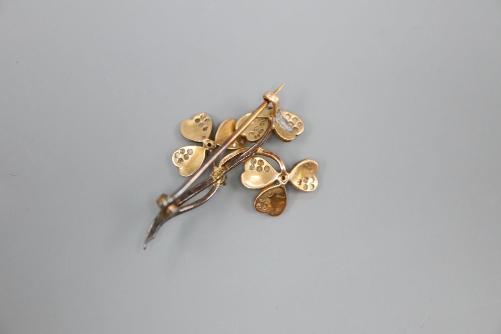 A 14ct gold diamond and enamel clover brooch, lacking some petals, 3.5cm, gross 4.3 grams